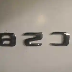 Эмблема от Mercedes-Benz