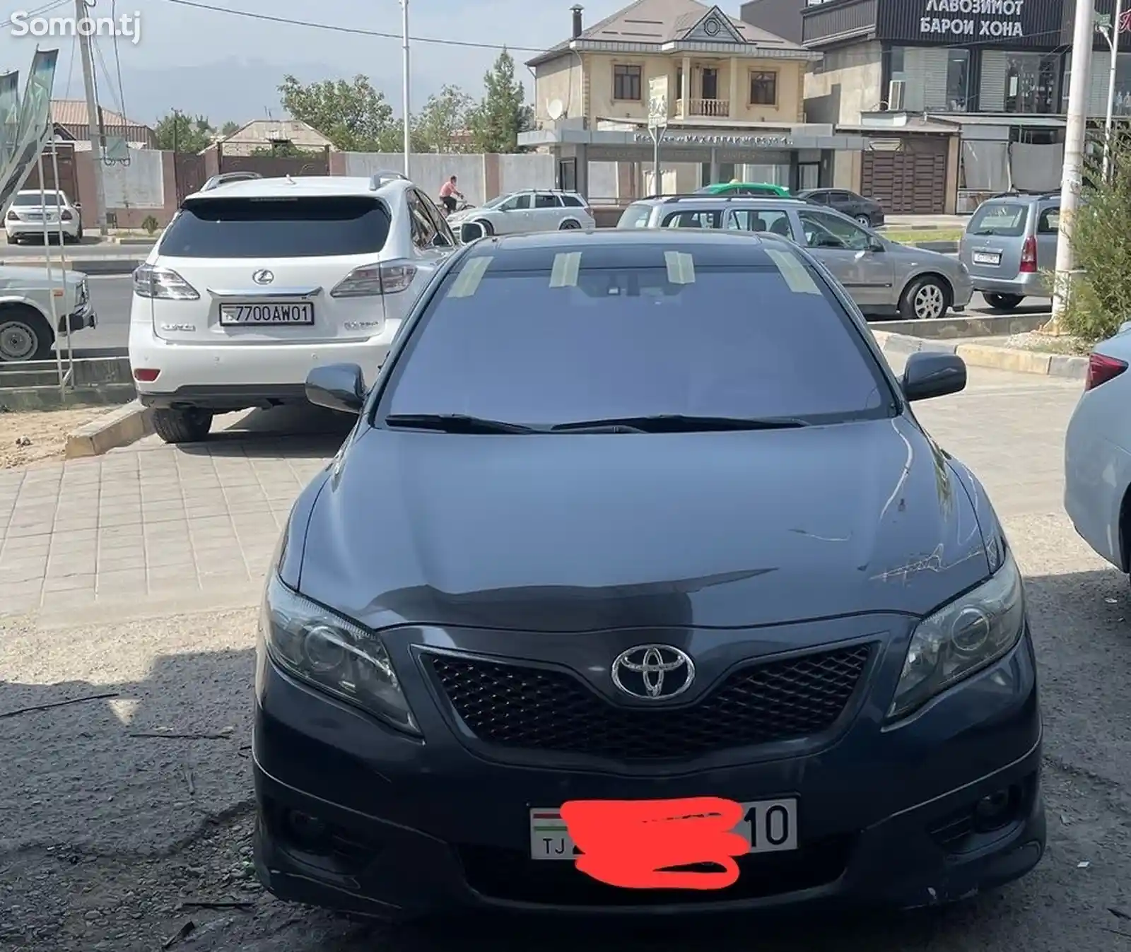 Лобовое стекло фиолетовый на Toyota Camry 2