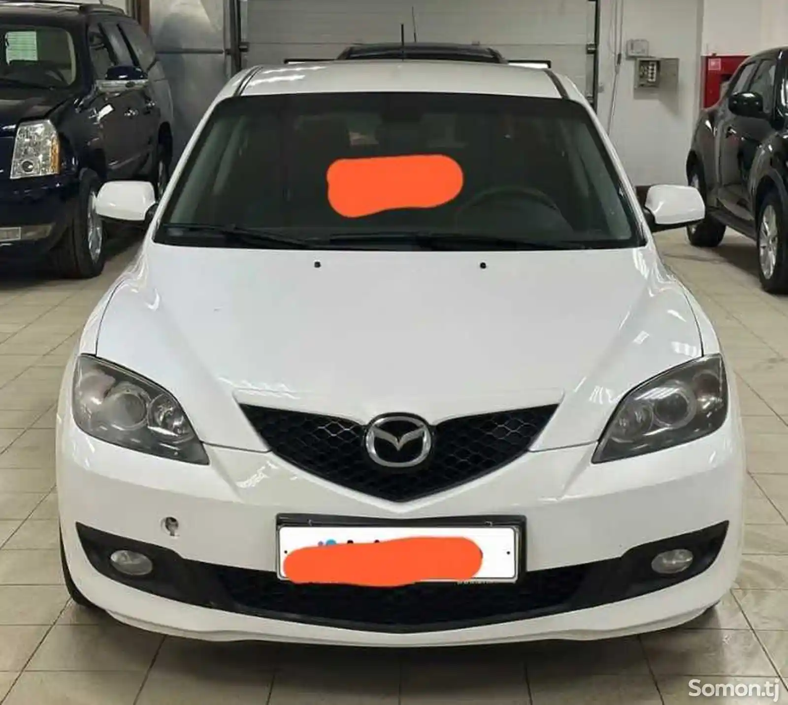 Лобовое стекло на Mazda 3 2003-2009