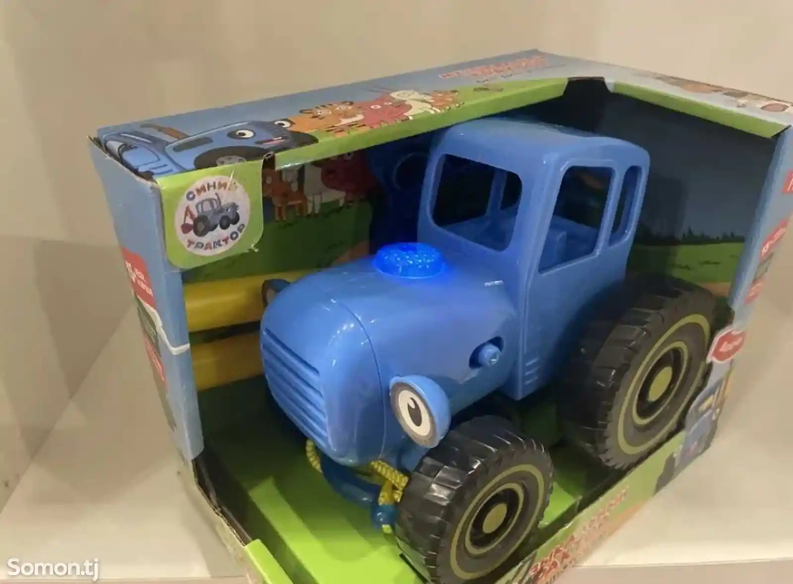 Синий трактор игрушка-1